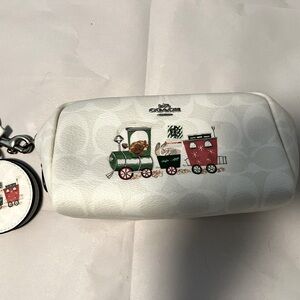 New, without tags. Holiday themed cosmetics bag with mirror.